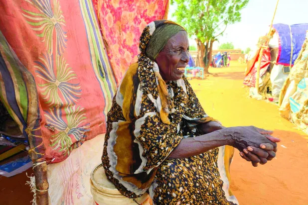 معاناة وجوع يرتسمان في محيا سودانية بمخيم الحمانية للنازحين جنوب كردفان 7 يوليو 2026 (أ.ف.ب)