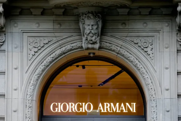 FILE PHOTO: The logo of Italian fashion company Giorgio Armani is seen at a shop in Zurich, Switzerland July 8, 2021. REUTERS/Arnd Wiegmann/File Photo
