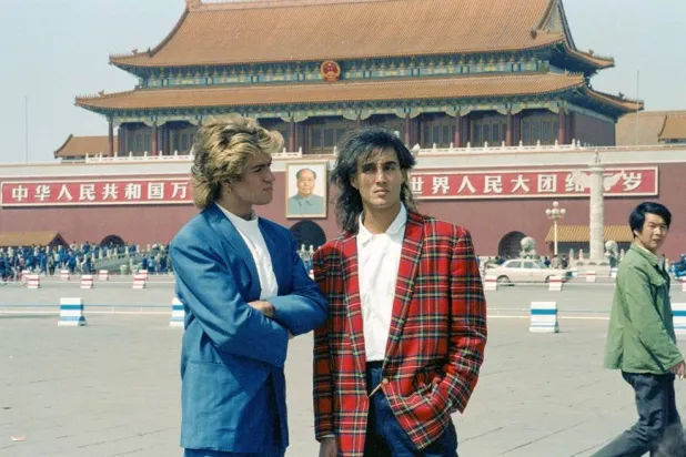 George Michael and Andrew Ridgeley of British pop duo Wham! pose in front of the Tiananmen Gate at Tiananmen Square, during their historic visit to China as the first Western pop act to perform in the country, in Beijing, China, April 7, 1985. (Reuters)