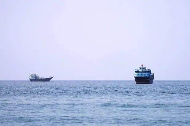 FILE PHOTO: Vessels at the Strait of Hormuz, as seen from Musandam, Oman, July 17, 2026. REUTERS/Stringer/File Photo