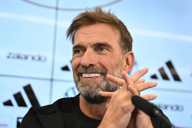 24 July 2026, Hesse, Frankfurt/Main: Juergen Klopp sits on the podium during a press conference to introduce the new national team head coach. Photo: Florian Wiegand/dpa