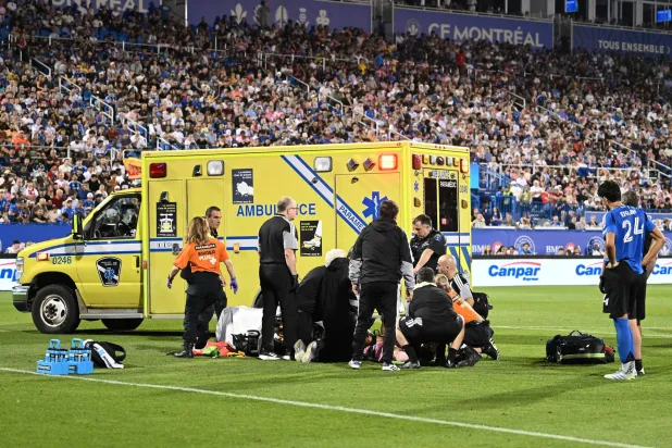 Paramedics tend to Inter Miami CF's German Berterame after he collided with CF Montreal's Efrain Morales (24) during second half MLS soccer action in Montreal, on Saturday, July 25, 2026. (Graham Hughes/The Canadian Press via AP)