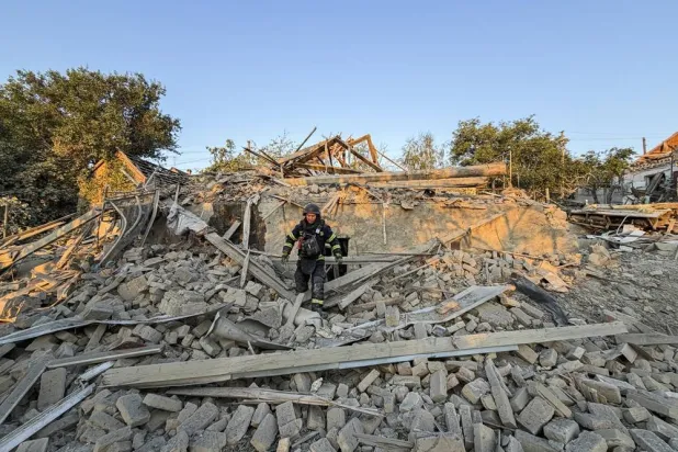 Ukrainian rescuers work at the site of a Russian attack on a building in Zaporizhzhia, Ukraine, 27 July 2026, amid the ongoing Russian invasion. (EPA)