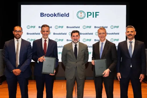 Yazeed Al-Humied, Deputy Governor and Head of MENA Investments at PIF and representatives of Brookfield (Asharq Al-Awsat)