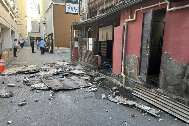 The exterior wall of a restaurant collapsed following the earthquake in Kumamoto City, southwestern Japan, 28 July 2026. (EPA/Jiji Press)