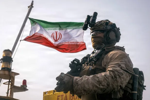 A US Marine on board an oil tanker in the Gulf of Oman during an inspection as part of the naval blockade on Iran (AFP)