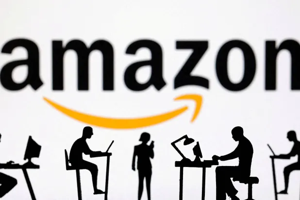 FILE PHOTO: Figurines with computers and smartphones are seen in front of Amazon logo in this illustration taken, February 19, 2024. REUTERS/Dado Ruvic/Illustration/File Photo