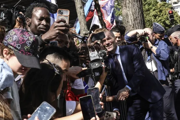 New head coach of the French men's national football team Zinedine Zidane meets supporters next to the French Soccer federation's headquarters in Paris, France, 28 July 2026. (EPA)