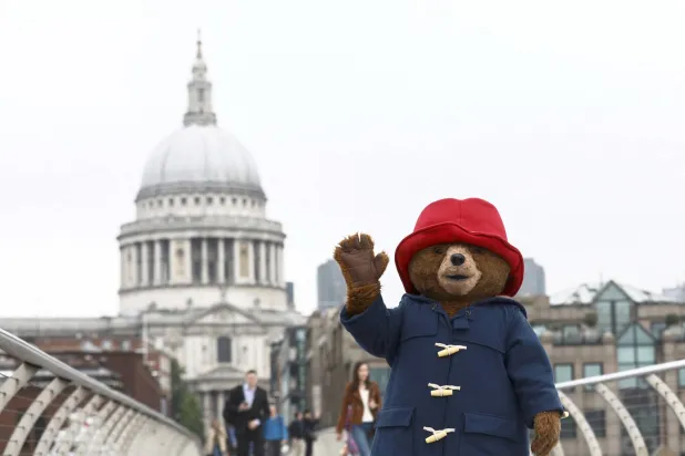 A performer wearing a Paddington Bear costume poses for photographers in front of St Paul's Cathedral in London, Britain, May 30, 2018. (Reuters)