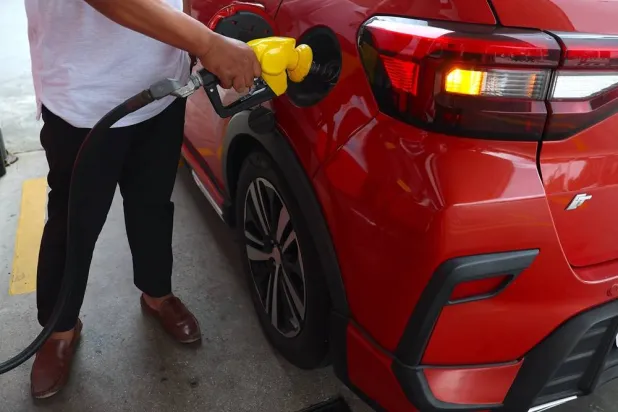 A man refuels his car at the petrol station in Kuala Lumpur, Malaysia, 24 July 2026. (EPA)