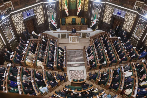 الرئيس السوري أحمد الشرع يلقي كلمةً في دمشق يوم الأحد 12 يوليو 2026 أمام الجلسة الافتتاحية لمجلس الشعب الذي شُكِّل حديثاً وهو الأول منذ سقوط حكومة الرئيس بشار الأسد (أ.ب)