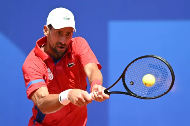 31 July 2024, France, Paris: Serbian tennis player Novak Djokovic in action against Germany's Dominik Koepfer during the Men's Tennis Singles Round of 16 at Roland-Garros Stadium. (dpa)