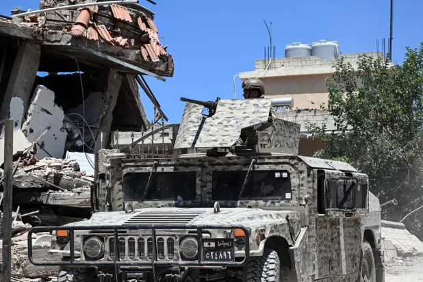 Lebanese soldiers patrol in Zawtar al-Gharbiya on July 28, 2026, as residents return to inspect their homes after the army deployed to the southern village last week as part of a framework deal reached with Israel (Photo by Joseph EID / AFP) 
