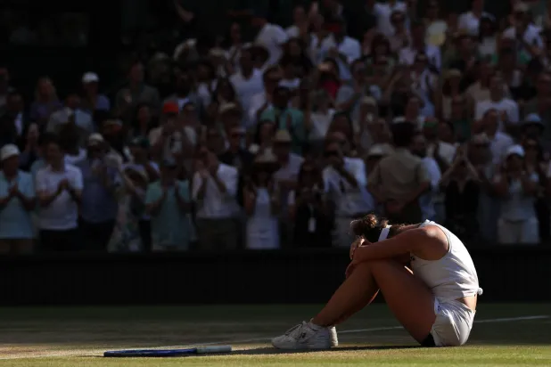 Czech Republic's Linda Noskova reacts after winning against Czech Republic's Karolina Muchova during their women's singles final tennis match on the thirteenth day of the 2026 Wimbledon Championships at The All England Lawn Tennis and Croquet Club in Wimbledon, southwest London, on July 11, 2026. (Photo by Adrian Dennis / AFP)