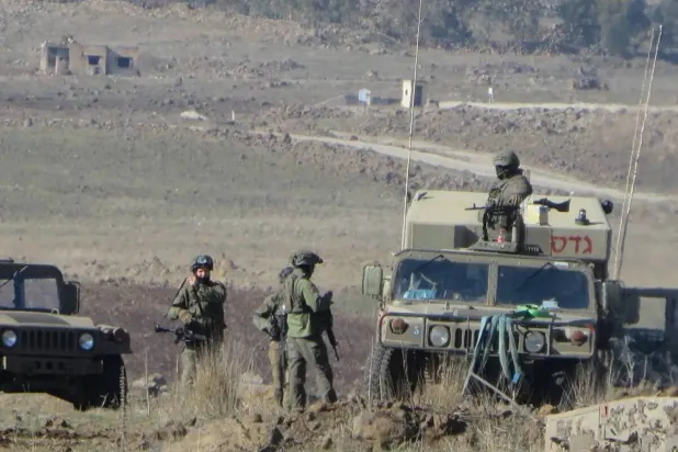  Israeli soldiers and military vehicles in the village of Dawaya al-Saqra, southwest of Syria’s Quneitra province. (File photo circulated online)