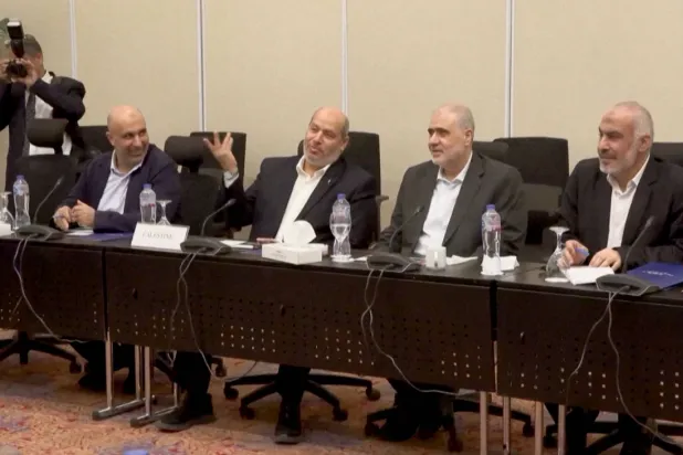 Senior Hamas official Khalil Al-Hayya gestures as he attends a meeting with Egyptian, Qatari and Turkish delegations ahead of a Gaza ceasefire deal announcement, in Sharm El-Sheikh, Egypt, October 8, 2025, in this still image obtained from a video. Al-Qahera News/Handout via REUTERS 