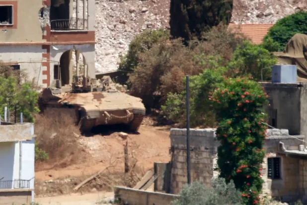 An Israeli tank stationed in Zawtar al-Charkieh, as seen from Zawtar al-Gharbiyah, Nabatieh Governorate, southern Lebanon, 31 July 2026, following a US-brokered security agreement between Lebanon and Israel. EPA/STRINGER