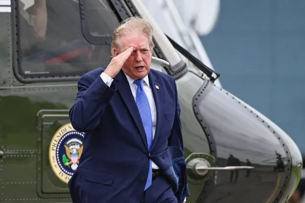 US President Donald Trump salutes after disembarking Marine One at Morristown Municipal Airport in Morristown, New Jersey, US, August 2, 2026. (Reuters)