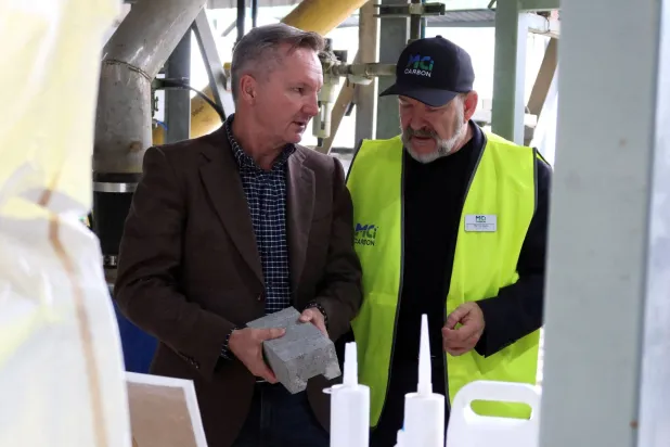 FILE PHOTO: Australian Energy Minister Chris Bowen and MCi Carbon's CEO Marcus Dawe at the carbon refinery facility in Newcastle, Australia, June 17, 2026. REUTERS/Cordelia Hsu/File Photo