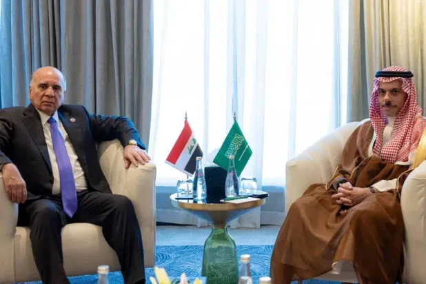 Saudi Foreign Minister Prince Faisal bin Farhan bin Abdullah and his Iraqi counterpart Fuad Hussein meet in Amman on Wednesday. (SPA)