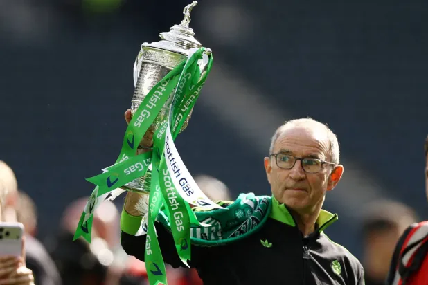 Football - Scottish Cup - Final - Celtic v Dunfermline Athletic - Hampden Park, Glasgow, Scotland, Britain - May 23, 2026 Celtic manager Martin O'Neill celebrates with the trophy after winning the Scottish Cup. (Reuters) 