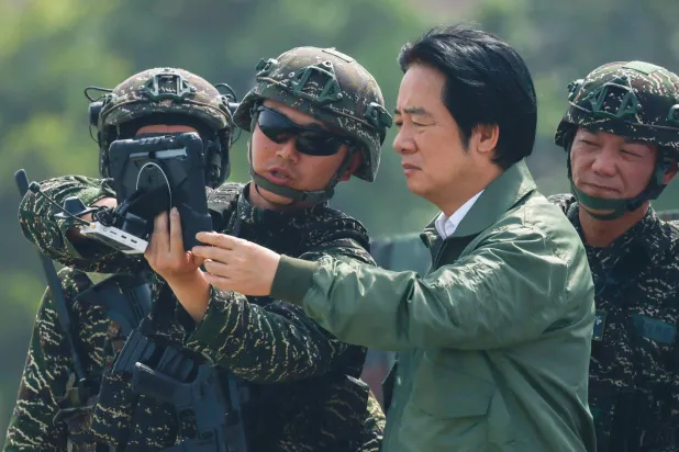  Taiwanese President Lai Ching-te attends a drone demonstration during the annual Han Kuang military exercises at a navy base in Kaohsiung, Taiwan, August 8, 2026. (Reuters)