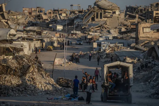 Displaced Palestinians walk between destroyed houses in Jabaliya, northern Gaza City, 07 August 2026. EPA/MOHAMMED SABER