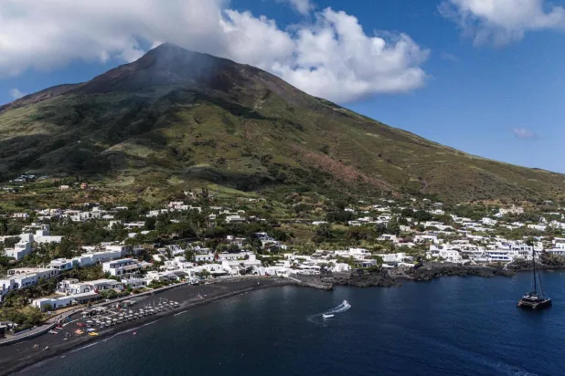This aerial view shows the Stromboli Island, part of the Aeolian archipelago off Sicily, on July 8, 2026. (Photo by Marco BERTORELLO / AFP)