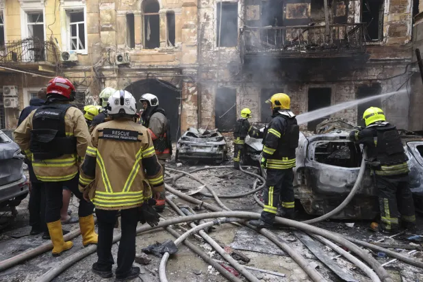 Ukrainian rescuers work at the site of a Russian strike on a residential area in downtown Odesa, Ukraine, 09 August 2026, amid the Russian invasion. EPA/IGOR MASLOV