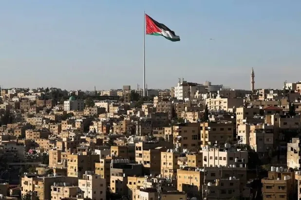 A Jordanian flag flies over the capital city, Amman, Jordan August 17, 2025. (Reuters file)