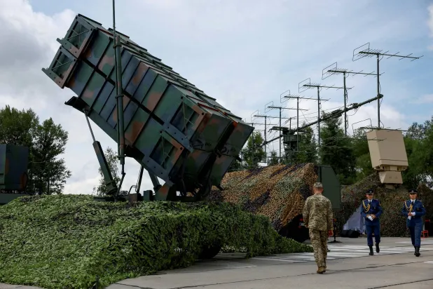 Ukrainian service members walk next to a launcher of a Patriot air defense system, amid Russia's attack on Ukraine, in an undisclosed location, Ukraine August 4, 2024. (Reuters)