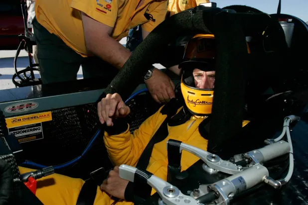 FILE - British driver Andy Green gets strapped into his seat before setting a new unofficial world diesel powered land speed record of over 328 mph over two runs Tuesday, Aug. 22, 2006, on the Bonneville Salt Flats of Utah. (AP Photo/Douglas C. Pizac,File)