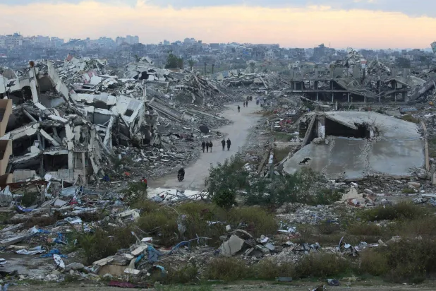 (FILES) A general view of destroyed houses in Nuseirat camp in the central Gaza Strip on December 19, 2025. (Photo by Eyad Baba / AFP)