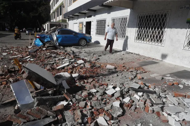 A vehicle damaged by a collapsed wall is seen following an earthquake in Cali, Colombia, 10 August 2026.  EPA/ERNESTO GUZMAN