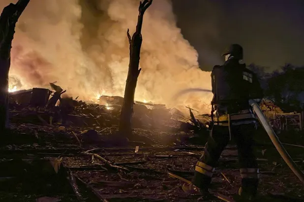 Ukrainian rescuers work at the site of a Russian attack on a residential area in Zaporizhzhia, Ukraine, 11 August 2026. (EPA)