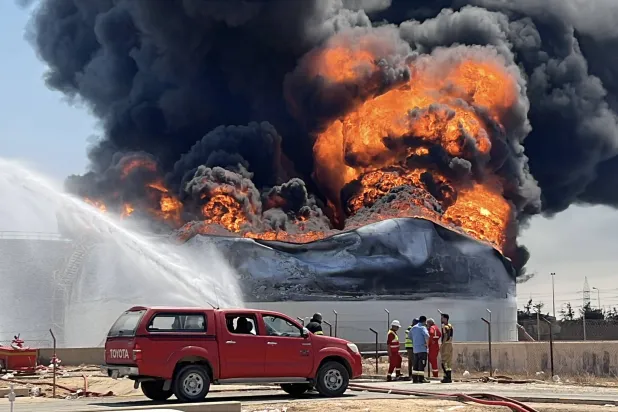 Firefighters work to extinguish a fire at a fuel storage tank at the Zawiya oil depot, west of Tripoli, Libya, 11 August 2026. (EPA)