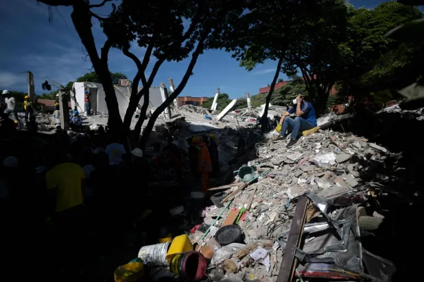  A rescuer sits on the rubble of a collapsed building after an earthquake in Cali, Colombia on August 11, 2026. (AFP)