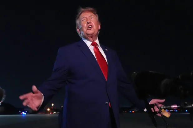  President Donald Trump talks to reporters after arriving on Air Force One Tuesday, Aug. 11, 2026, at Joint Base Andrews, Md. (AP) 