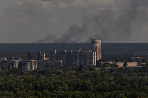  This photograph shows smoke rising in the distance following a Russian air attack, in Kyiv on August 12, 2026, amid the Russian invasion of Ukraine. (AFP) 
