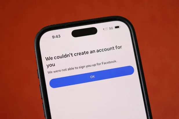 A Facebook message is displayed on a mobile phone, as Meta begins blocking new sign-ups for anyone under 16 in Australia, in this picture illustration taken December 3, 2025. (Reuters)