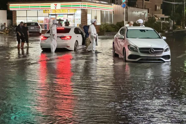 A view of a flooded road following heavy rain in Ichikawa, Chiba prefecture, near Tokyo, Japan, late 13 August 2026 (issued 14 August 2026). EPA/JIJI PRESS
