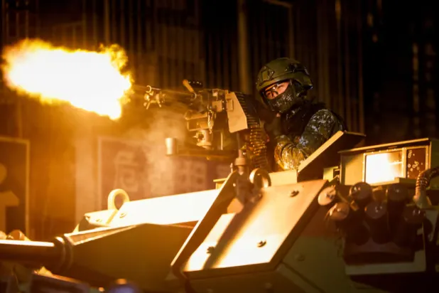 A Taiwanese military member fires ammunition aboard an armoured vehicle during a drill as part of the annual Han Kuang military exercises in Taipei, Taiwan, August 13, 2026. REUTERS/Ann Wang 