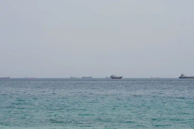 FILE PHOTO: Vessels near the Strait of Hormuz, as seen from Musandam, Oman, August 10, 2026. REUTERS/Stringer/File Photo