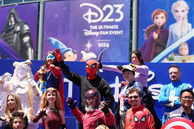 Marvel Universe cosplayers take part in a photo op outside the entrance to D23: The Ultimate Disney Fan Event on Friday, Aug. 14, 2026, at the Anaheim Convention Center in Anaheim, Calif. (AP Photo/Chris Pizzello)