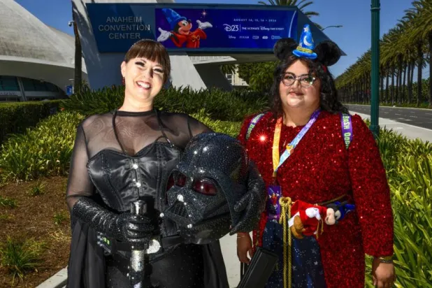 Fans show up to tune out the world at Disney's D23 fan convention. Jerod Harris / AFP
