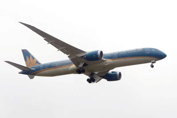 FILE PHOTO: A Vietnam Airlines Boeing 787-9 Dreamliner airplane prepares for landing at Noi Bai international airport in Hanoi, Vietnam March 7, 2017. REUTERS/Kham/File Photo