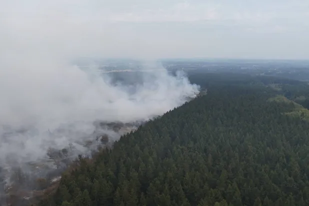 This aerial photograph shows a wildfire burning in the Hautes Fagnes (High Fens) nature reserve in Waimes on August 15, 2026. (AFP)