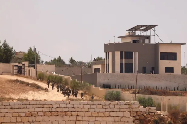 Israeli troops arrive during a military raid in the town of Qusra, south of Nablus, West Bank, 16 August 2026. (EPA)