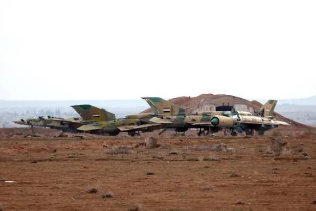 A picture taken on January 21, 2018 shows damaged Syrian air force fighter planes at the Abu Duhur military airport area in Syria's Idlib province. (File/AFP)