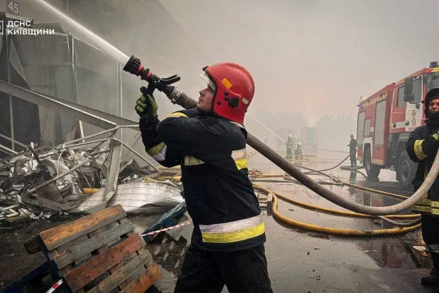 Firefighters work at a site of a Russian drone attack, amid Russia's attack on Ukraine, in the Kyiv region, Ukraine, in this handout picture released August 18, 2026. Press service of the State Emergency Service of Ukraine in Kyiv region/Handout via REUTERS 
